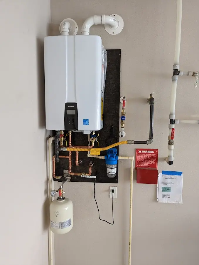 Professional plumber installing copper piping in a Lakeland home